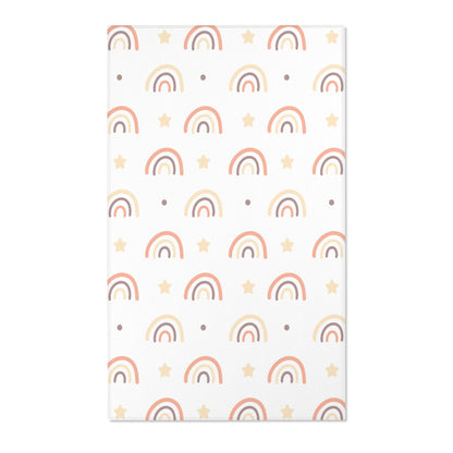 Rainbow nursery area rug in soft peach, cream and taupe