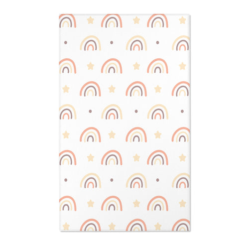 Rainbow nursery area rug in soft peach, cream and taupe