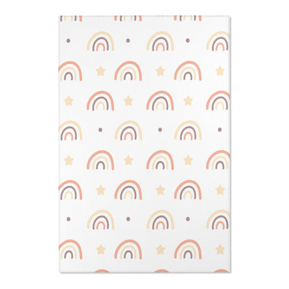 Close detail of the drawn rainbows on the nursery area rug