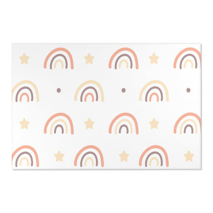 Low pile nursery rug with peach rainbows and cream stars