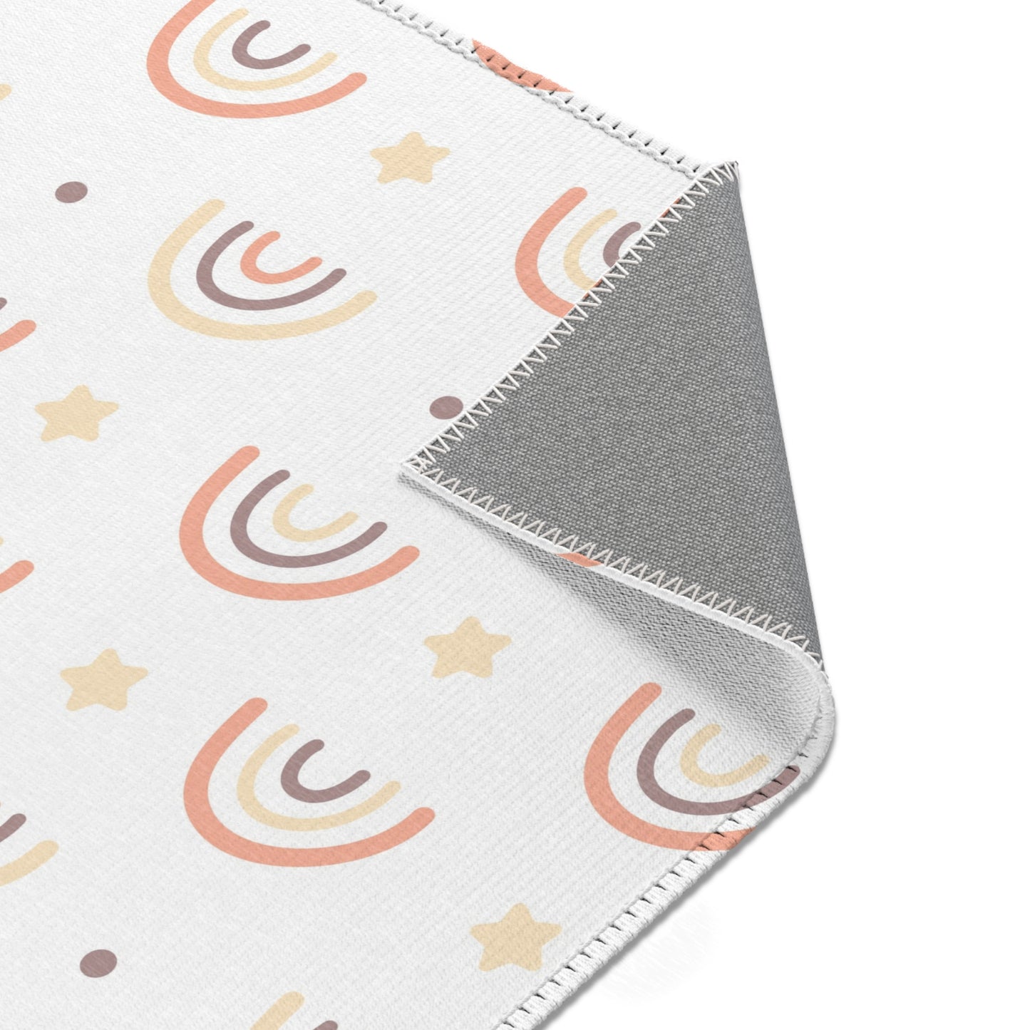 Nursery area rug printed edge to edge with drawn rainbows