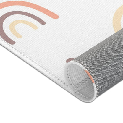 Corner detail of the Peach Rainbow nursery area rug