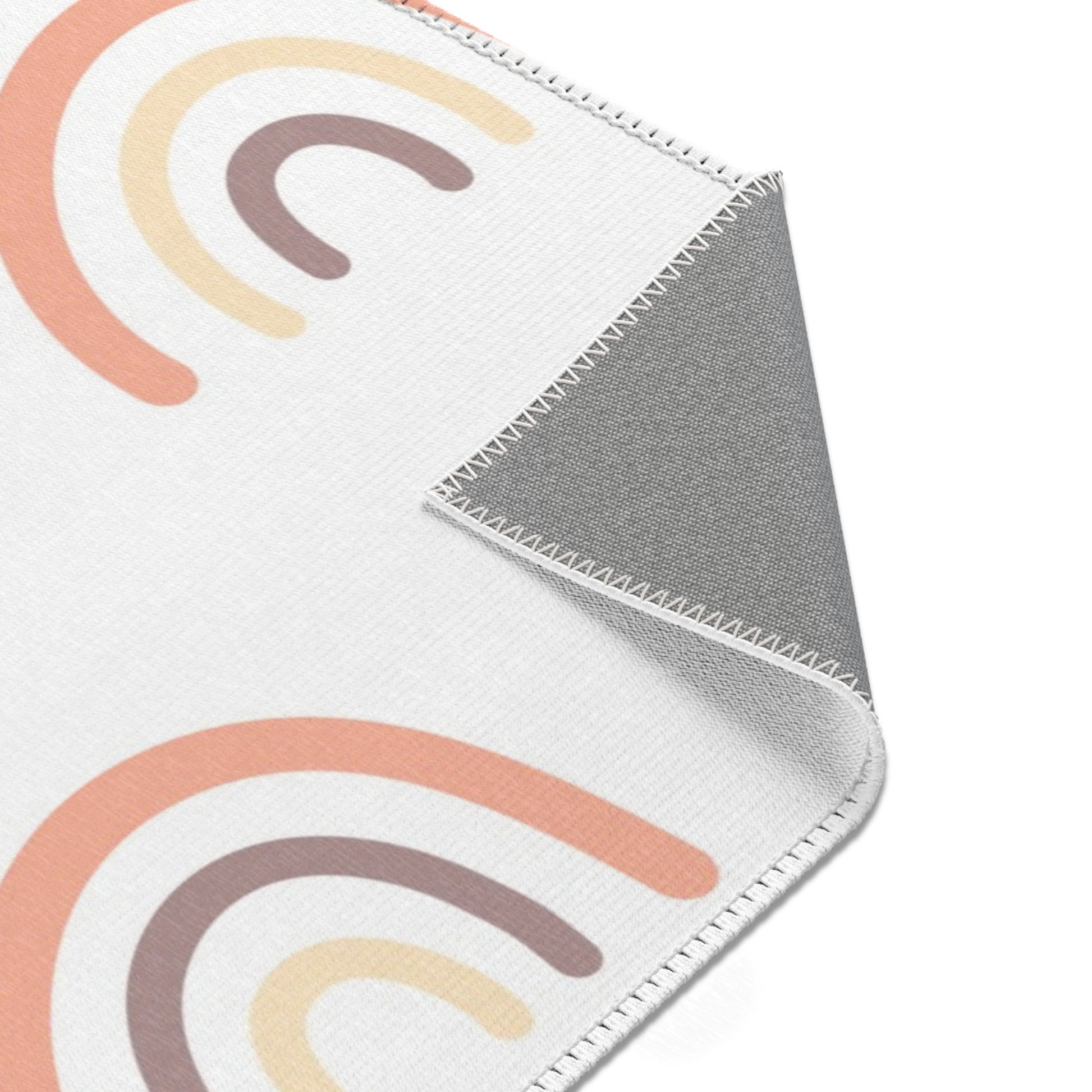 Peach Rainbow rug print detail in peach and cream