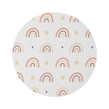 Peach Rainbow round nursery rug on a baby room floor