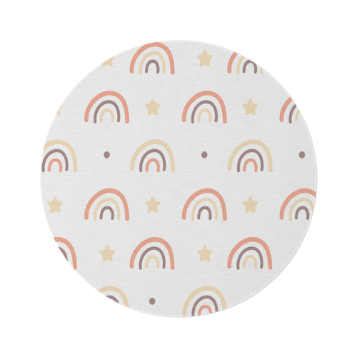 Peach Rainbow round nursery rug on a baby room floor