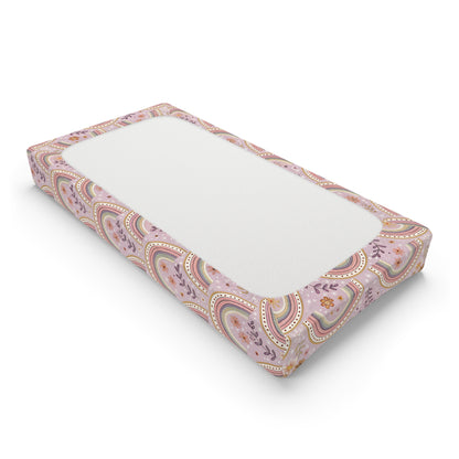 Changing pad cover with scalloped rows of blush arches
