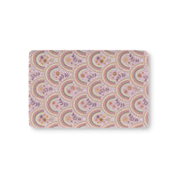 Petal Arches fitted crib sheet on a nursery crib mattress