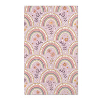 Blush arch nursery area rug on a soft mauve ground