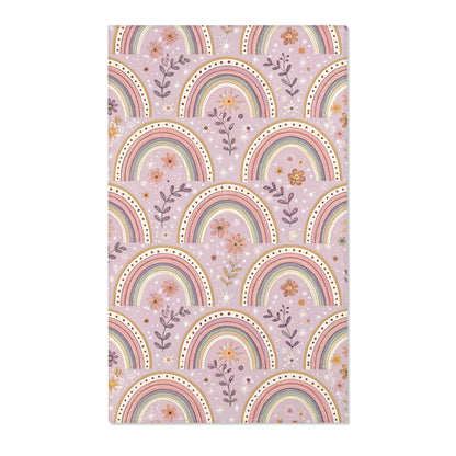 Blush arch nursery area rug on a soft mauve ground