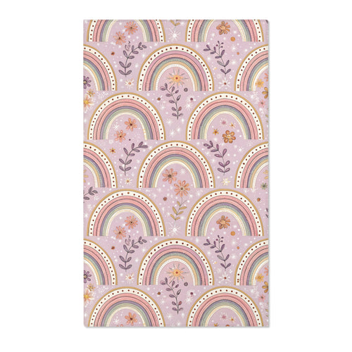 Blush arch nursery area rug on a soft mauve ground