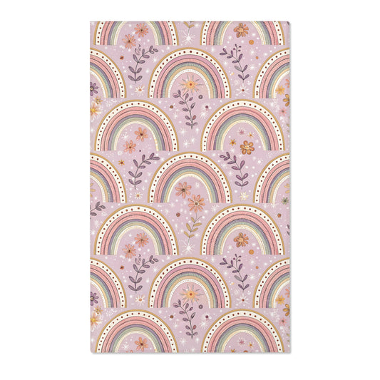 Blush arch nursery area rug on a soft mauve ground