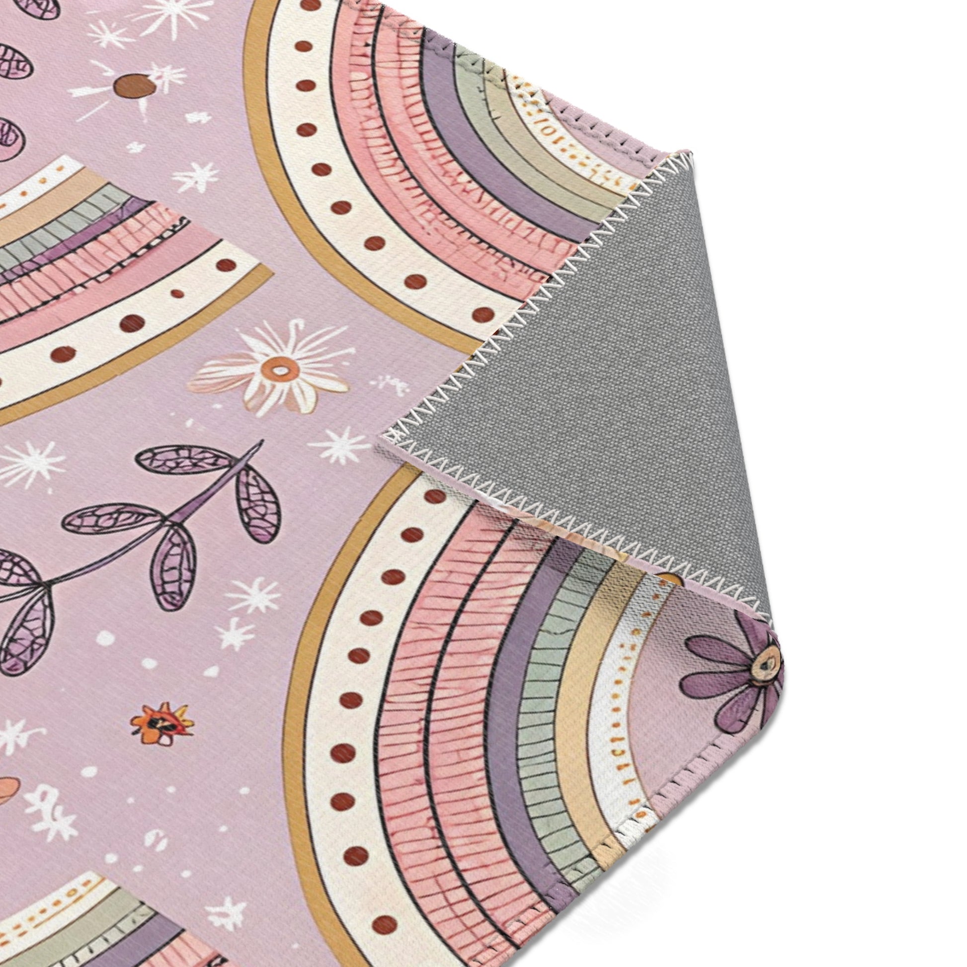 Blush arch rug in mauve and sage for a nursery floor