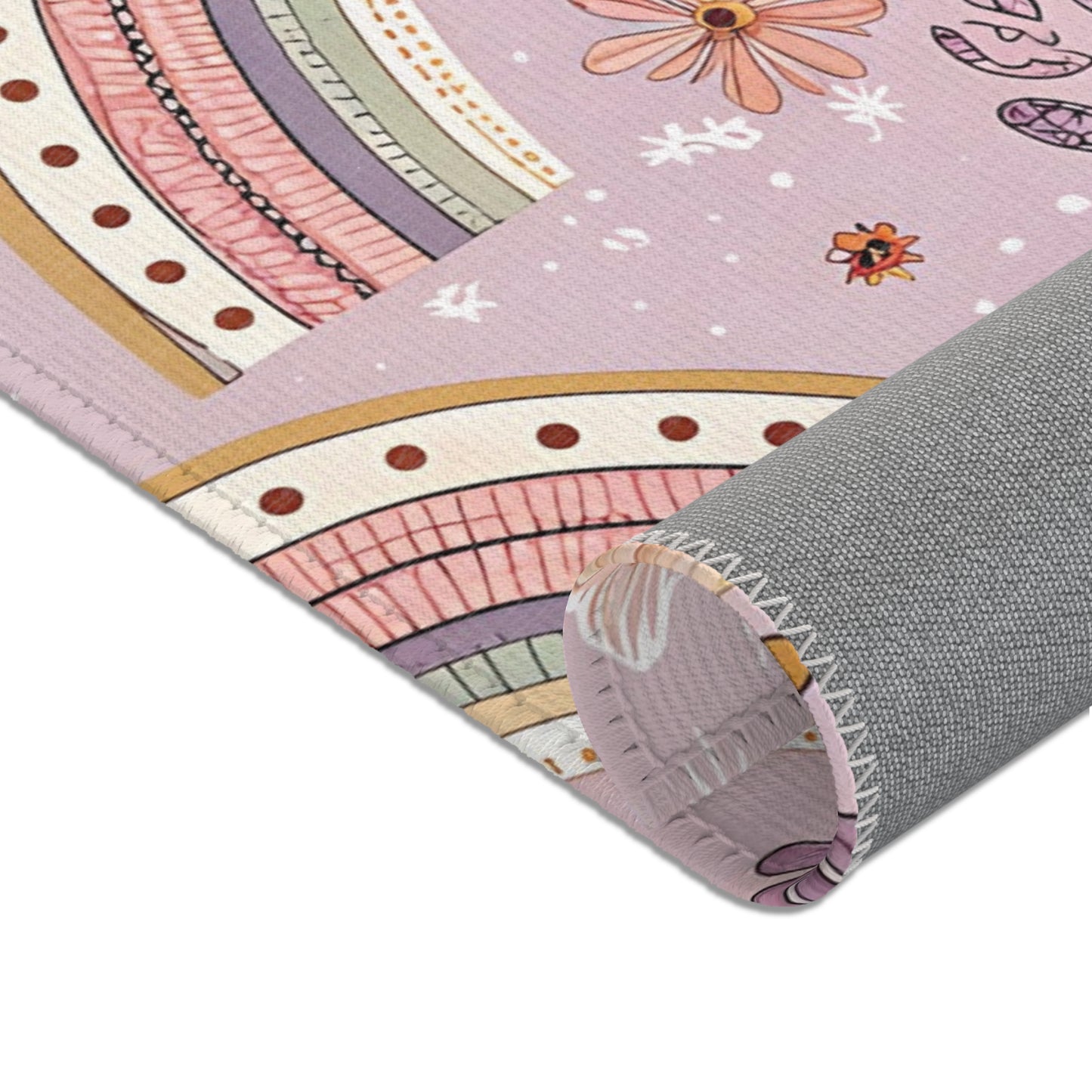 Corner detail of the Petal Arches nursery area rug