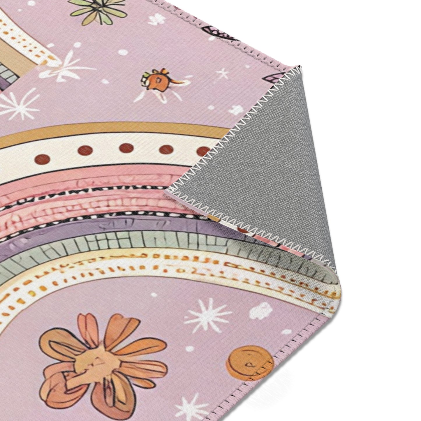 Petal Arches rug print detail in blush and gold