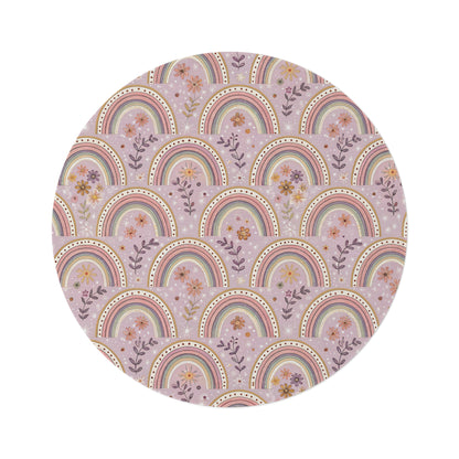 Petal Arches round nursery rug on a baby room floor