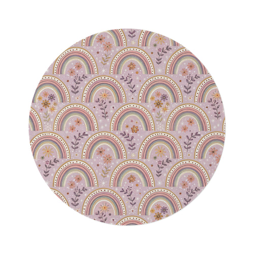 Petal Arches round nursery rug on a baby room floor