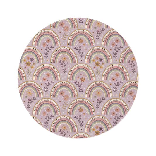 Petal Arches round nursery rug on a baby room floor