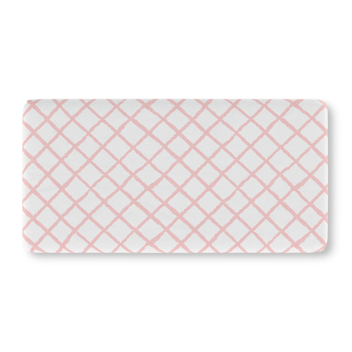 Soft pink lattice crib sheet showing the fitted elasticated corner