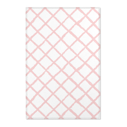 Pink trellis nursery area rug in a baby girl's bedroom