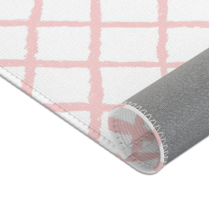 Soft pink lattice nursery rug shown at full size