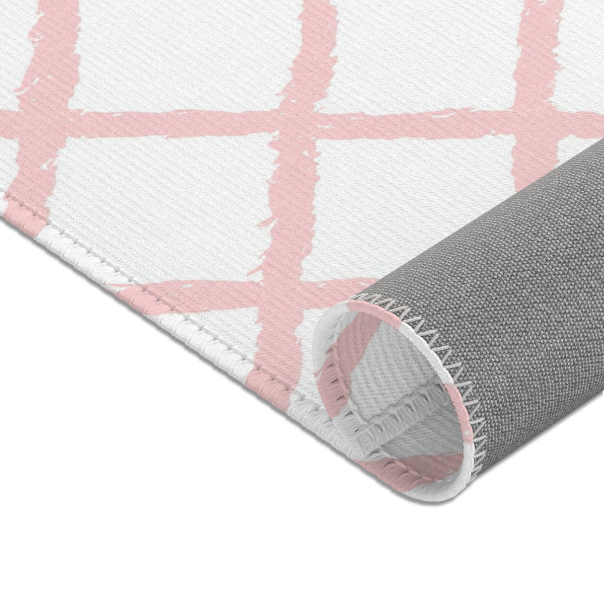 Pink lattice print baby room rug in a styled nursery