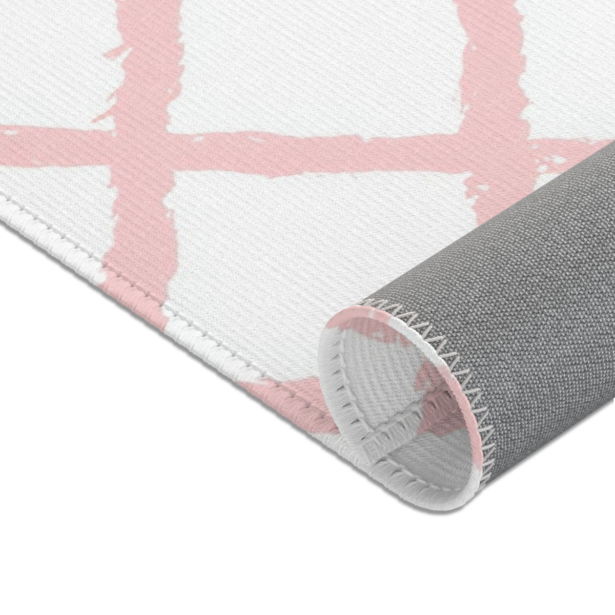 Pink lattice area rug in a baby girl nursery corner