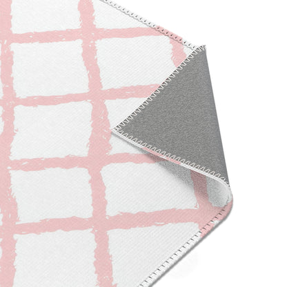 Pink trellis nursery area rug in landscape orientation