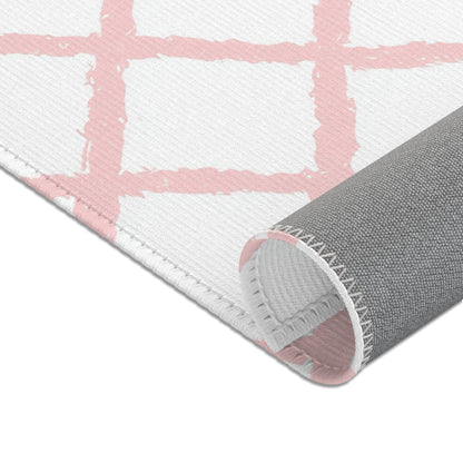 Pink trellis nursery area rug in portrait orientation