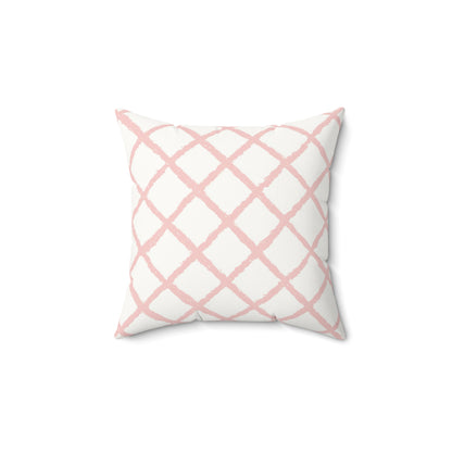 Pink trellis decorative nursery pillow on a glider chair