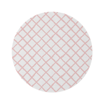 Pink trellis round nursery rug on a baby girl's bedroom floor