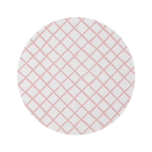 Pink trellis round nursery rug on a baby girl's bedroom floor
