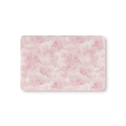 Pink watercolor clouds fitted crib sheet on a nursery crib mattress