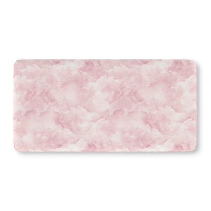 Soft pink cloud print crib sheet showing the fitted elasticated corner