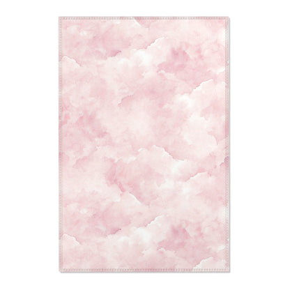 Pink watercolor clouds nursery area rug in a baby girl's bedroom
