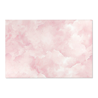 Corner detail of the pink watercolor clouds nursery rug