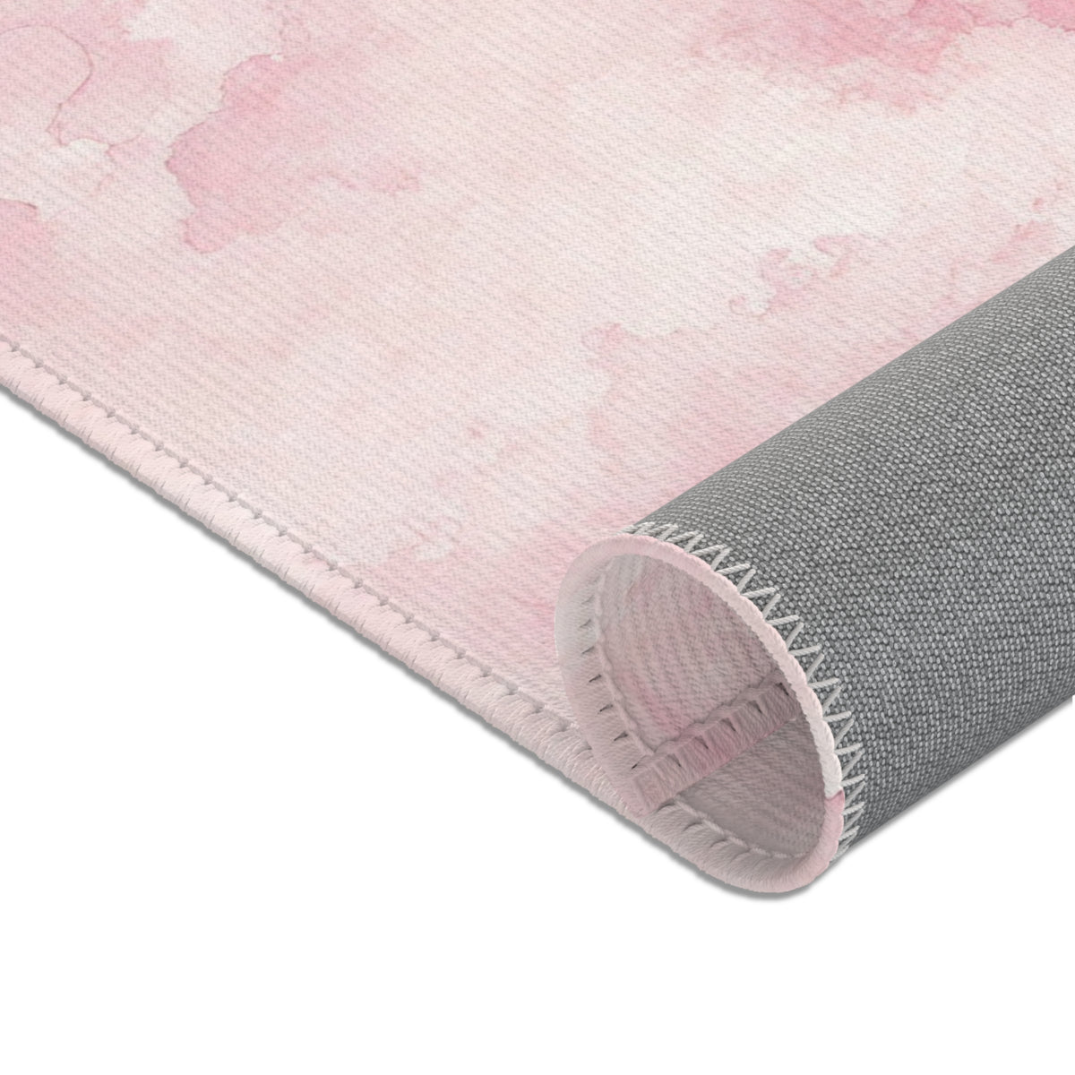 Pink cloud print baby room rug in a styled nursery