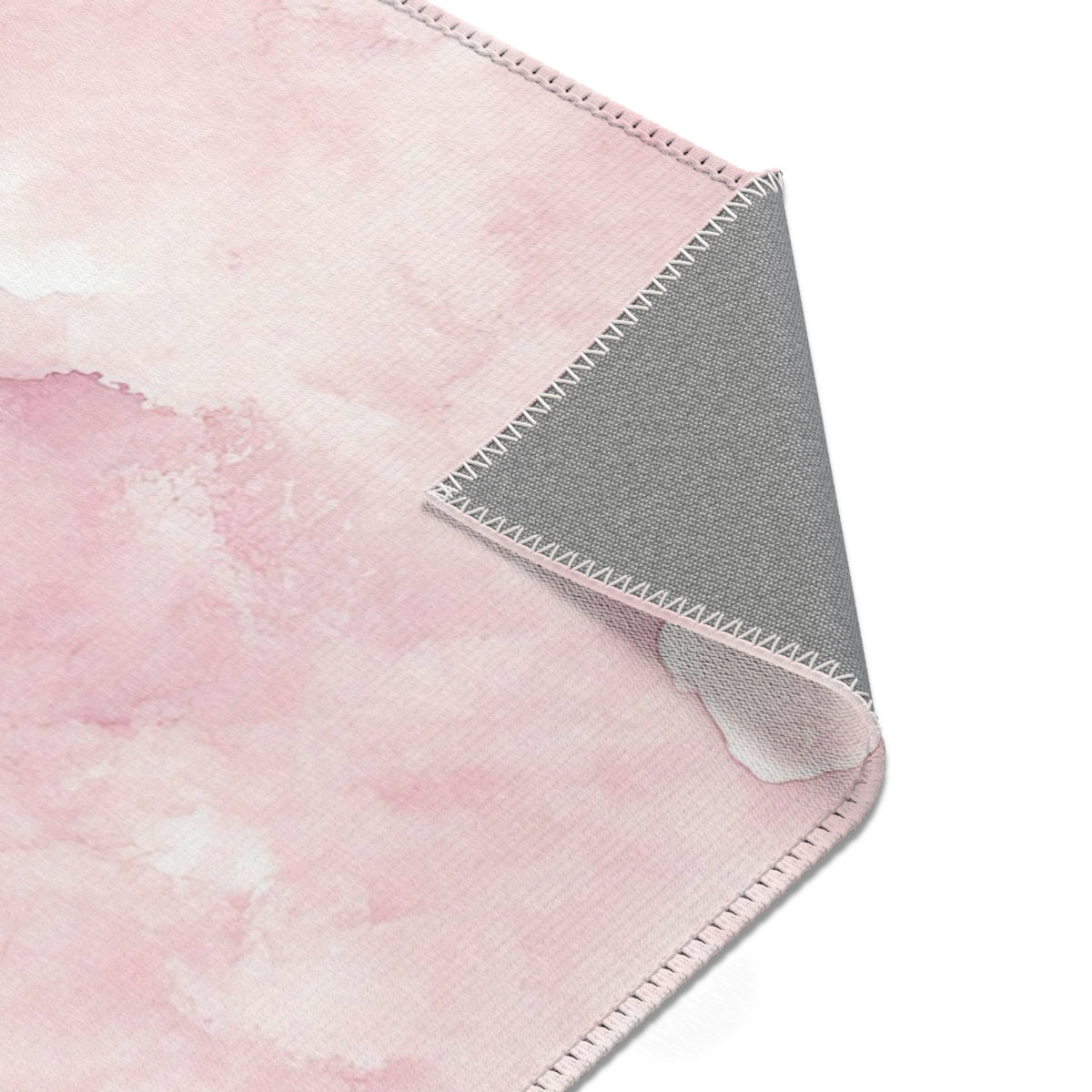 Pink watercolor clouds nursery rug edge and pile detail