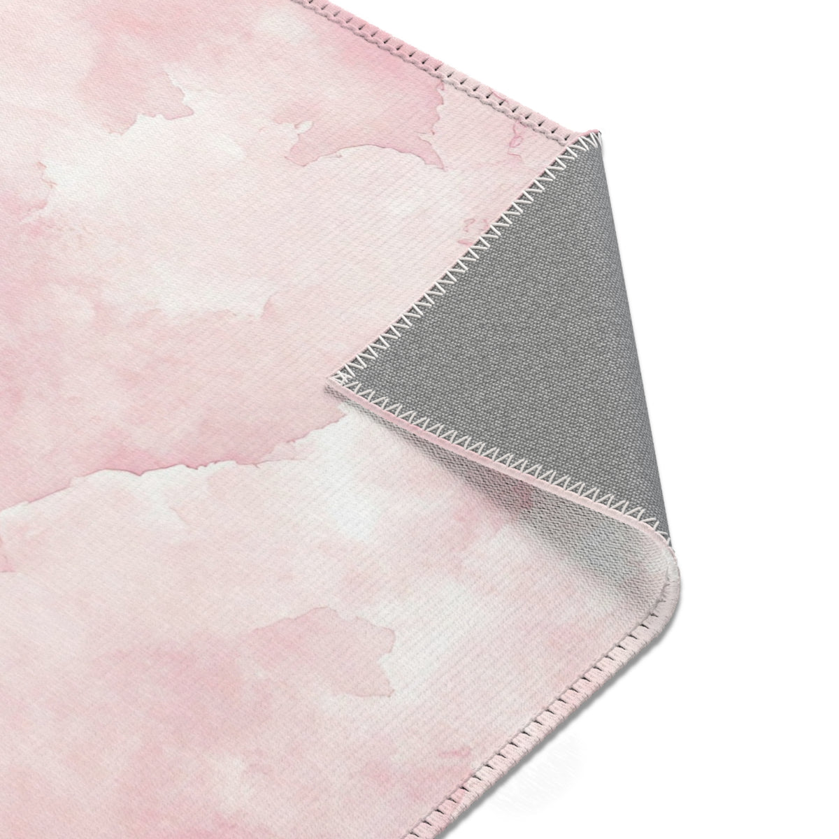 Pink watercolor clouds area rug in landscape orientation