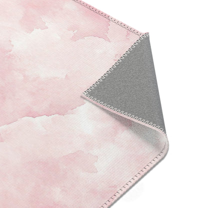 Pink watercolor clouds area rug in landscape orientation