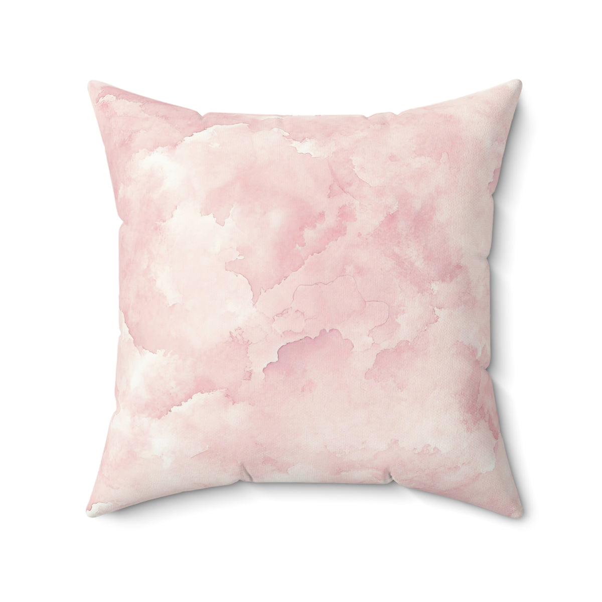Pink cloud print nursery pillow in a reading corner