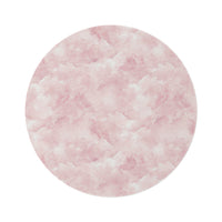 Pink watercolor clouds round nursery rug on a baby girl's bedroom floor
