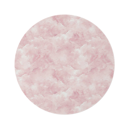Pink watercolor clouds round nursery rug on a baby girl's bedroom floor
