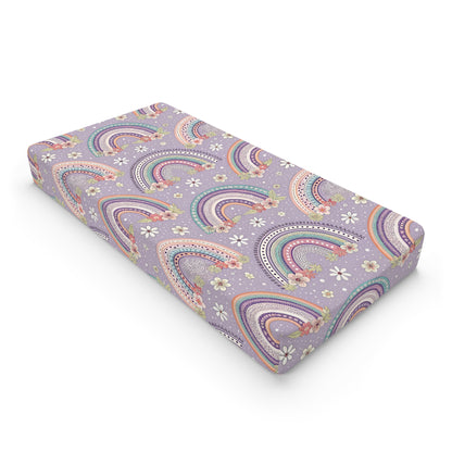 Posy Rainbows changing pad cover on a nursery changing table