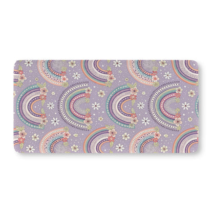 Fitted crib sheet with mint and coral rainbows on lilac