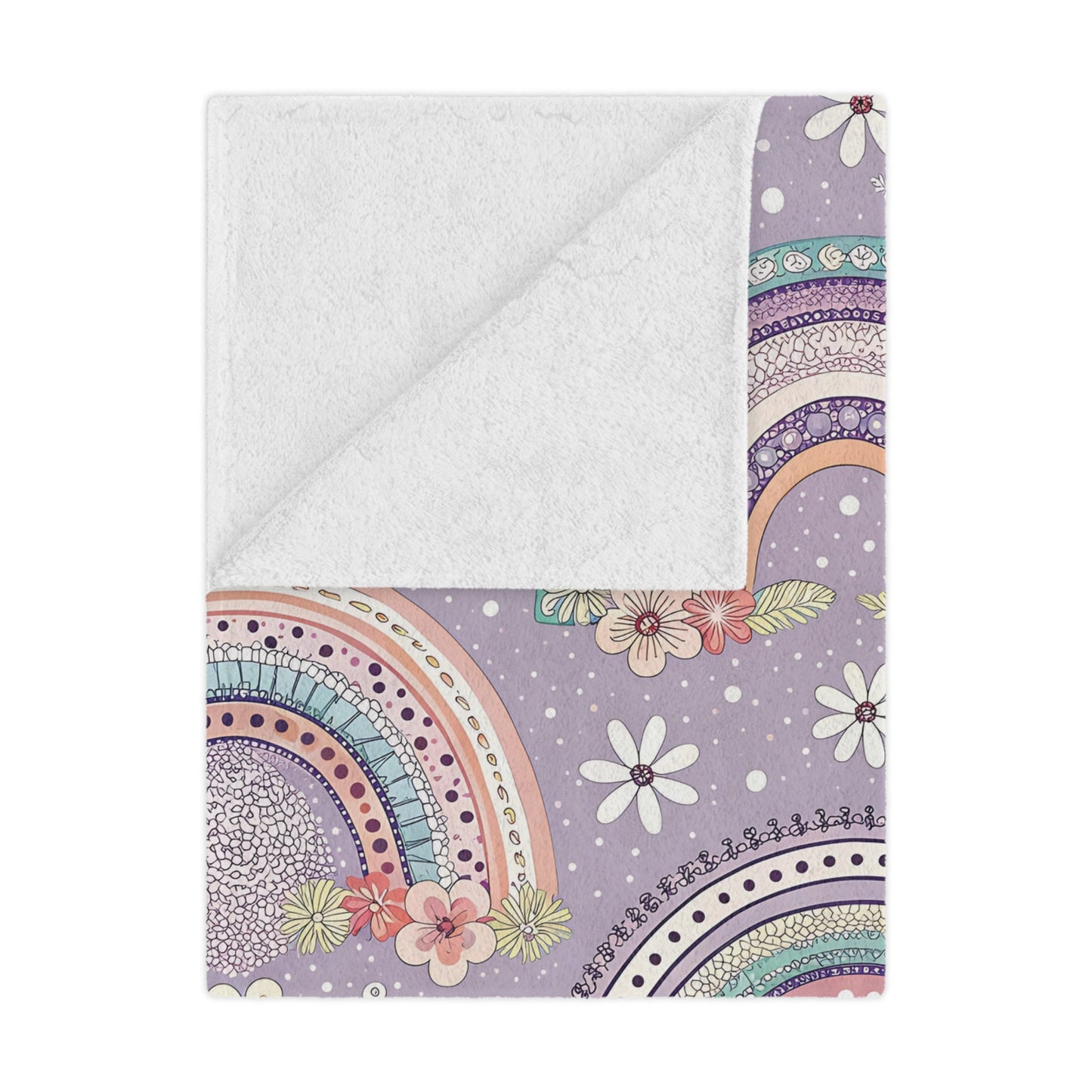 Posy Rainbows minky baby blanket draped over a crib