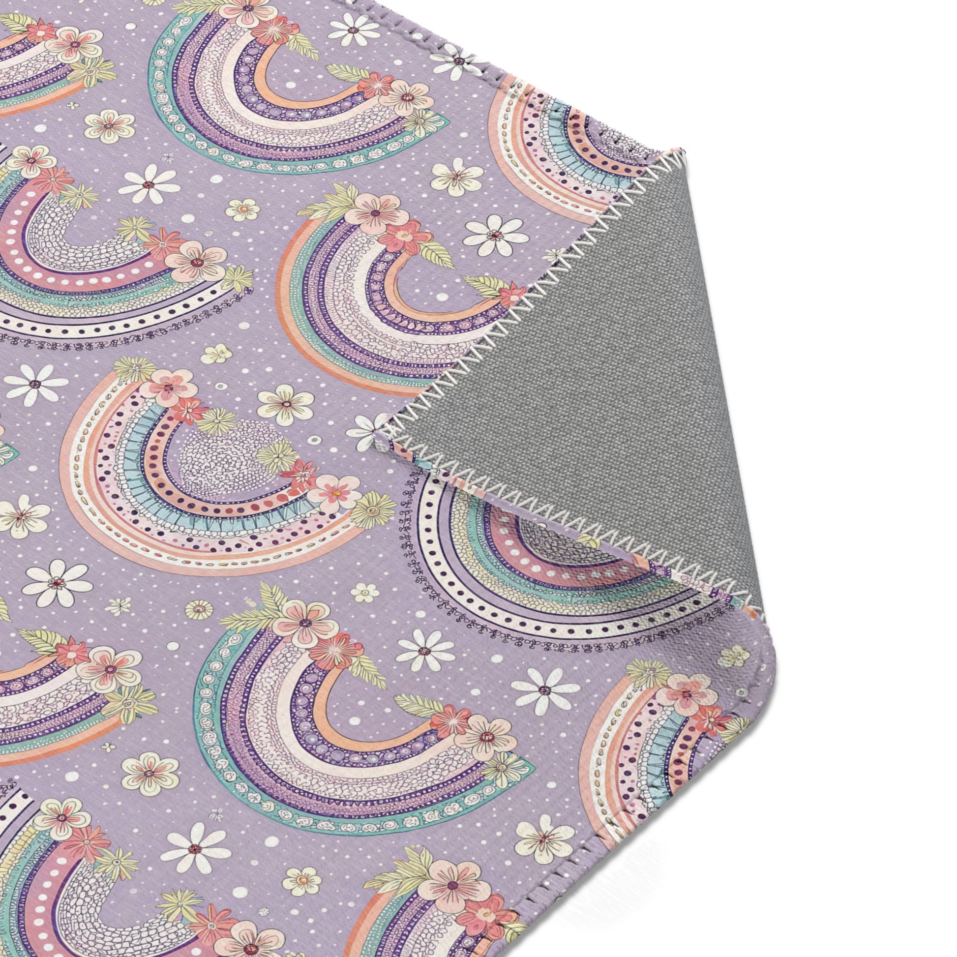 Nursery area rug printed edge to edge with banded rainbows