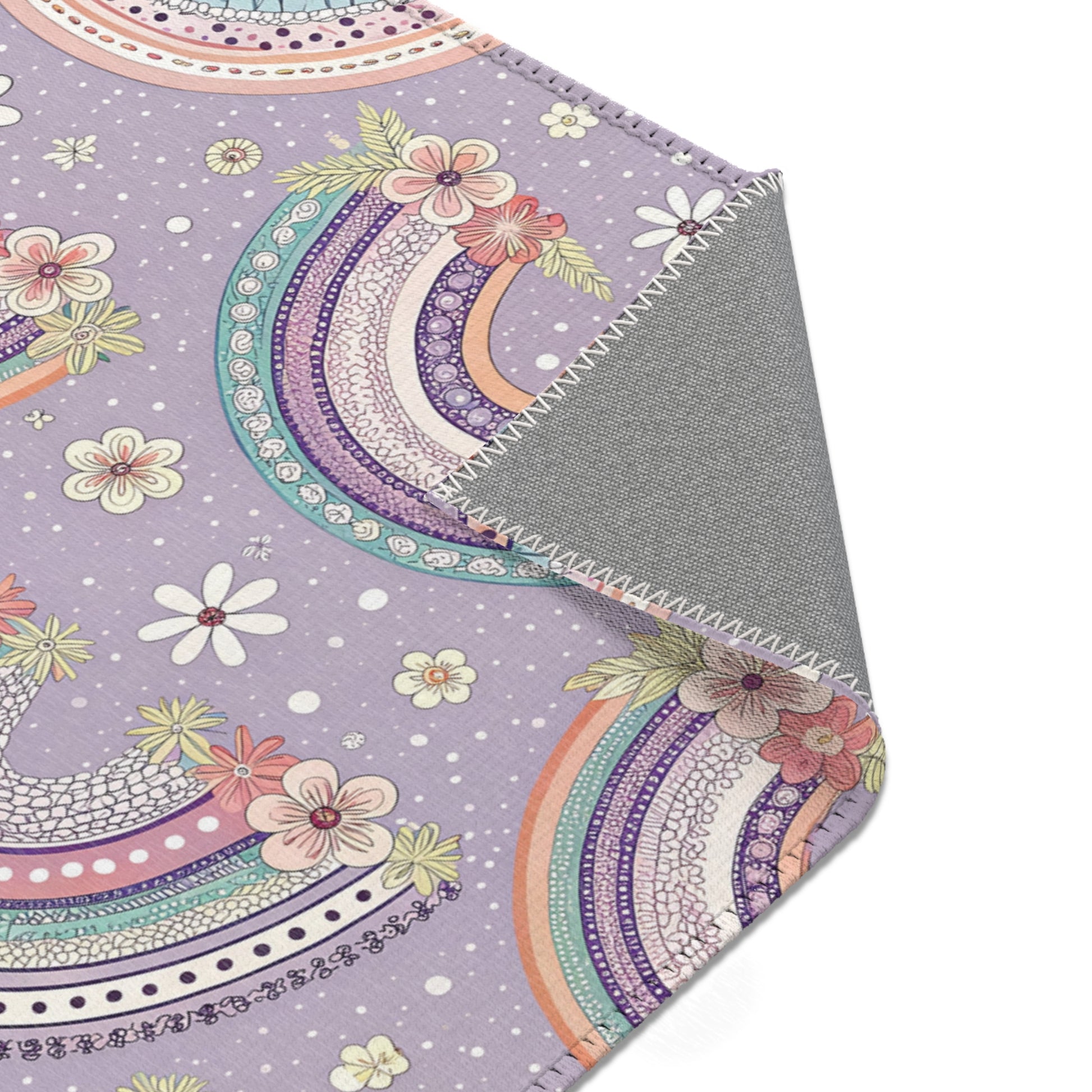 Lilac rainbow rug in mint and coral for a nursery floor