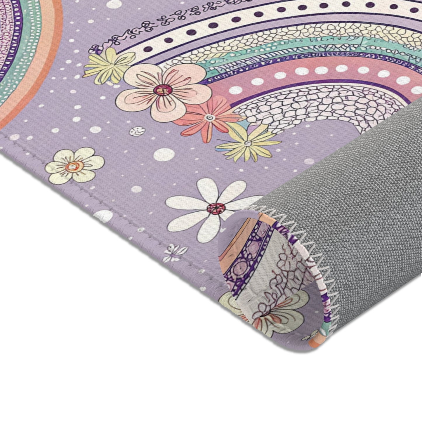 Nursery area rug in a lilac, mint and coral palette