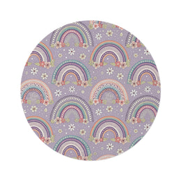 Posy Rainbows round nursery rug on a baby room floor
