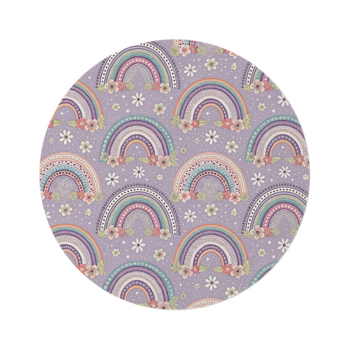 Posy Rainbows round nursery rug on a baby room floor